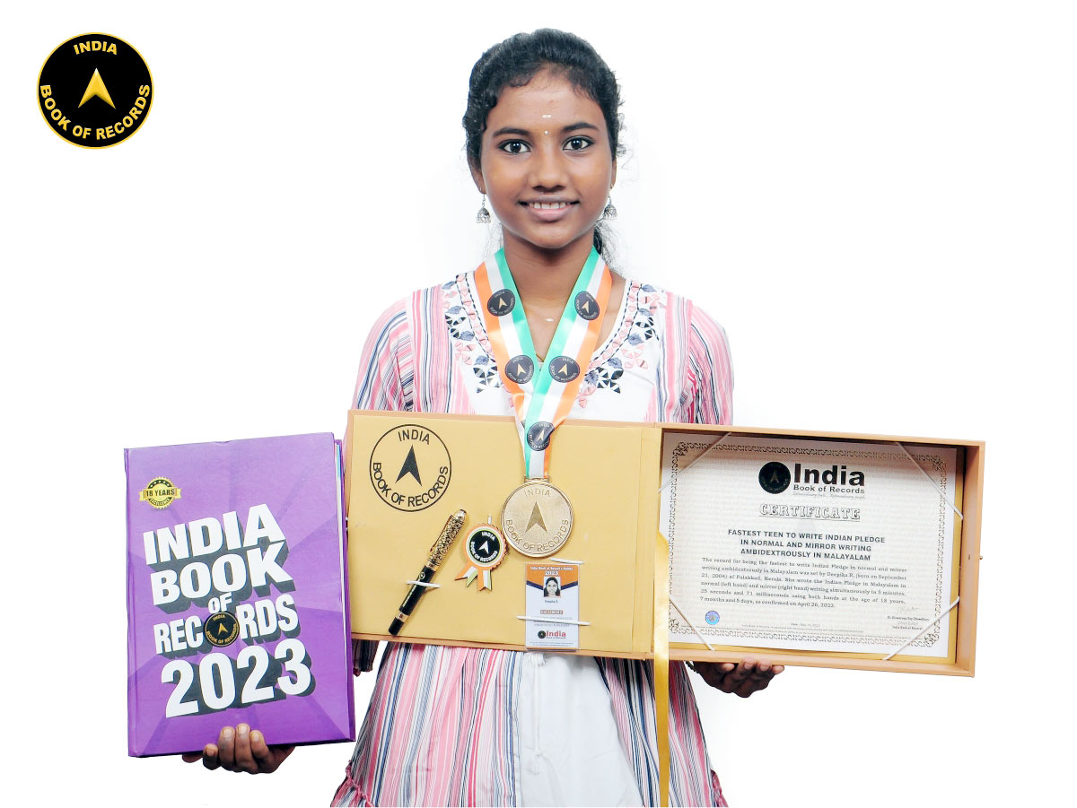 Fastest teen to write Indian Pledge in normal and mirror writing ambidextrously in Malayalam