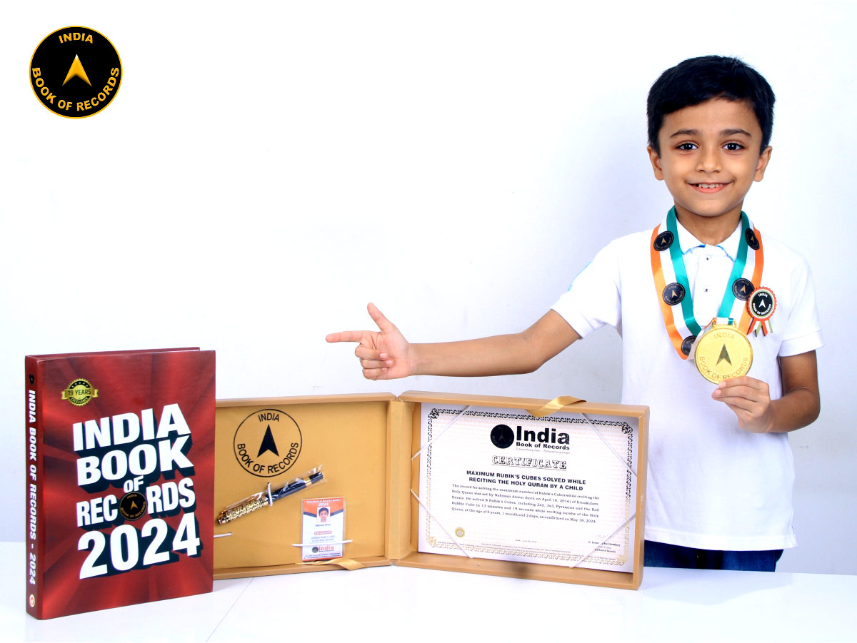Maximum Rubik’s Cubes solved while reciting the Holy Quran by a child