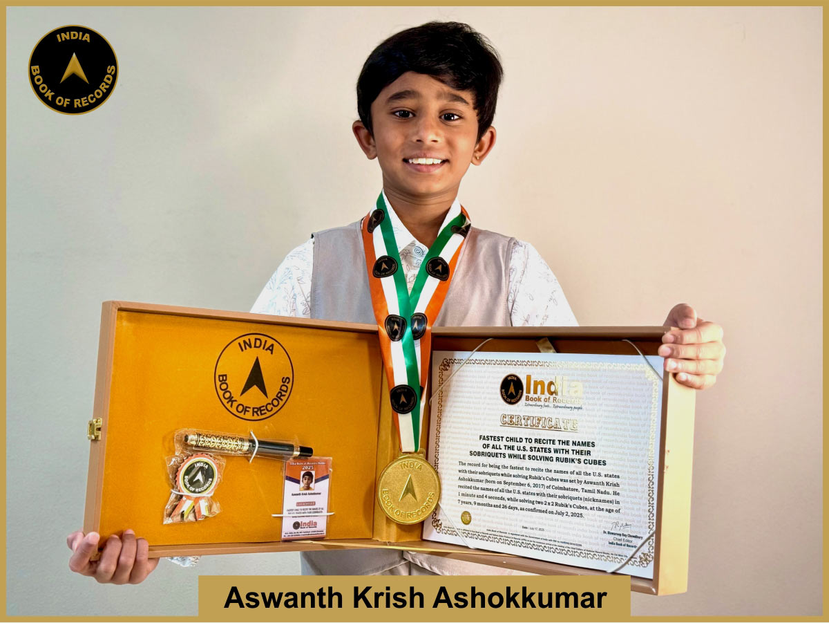Fastest child to recite the names of all the U.S. states with their sobriquets while solving Rubik’s Cubes