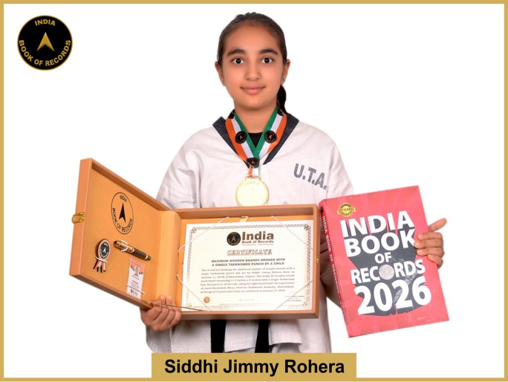 image of Maximum wooden boards broken with a single Taekwondo punch by Siddhi Jimmy Rohera.