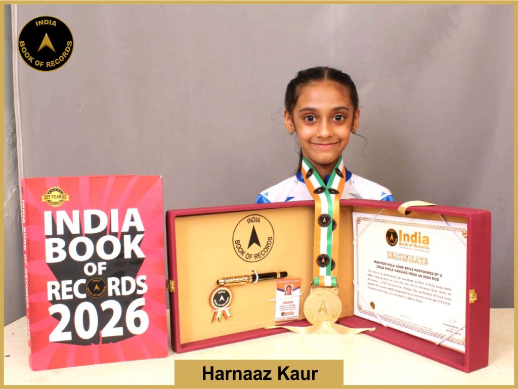 Image of Harnaaz Kaur, Maximum hula hoop spins performed by a child while hanging from an iron rod.