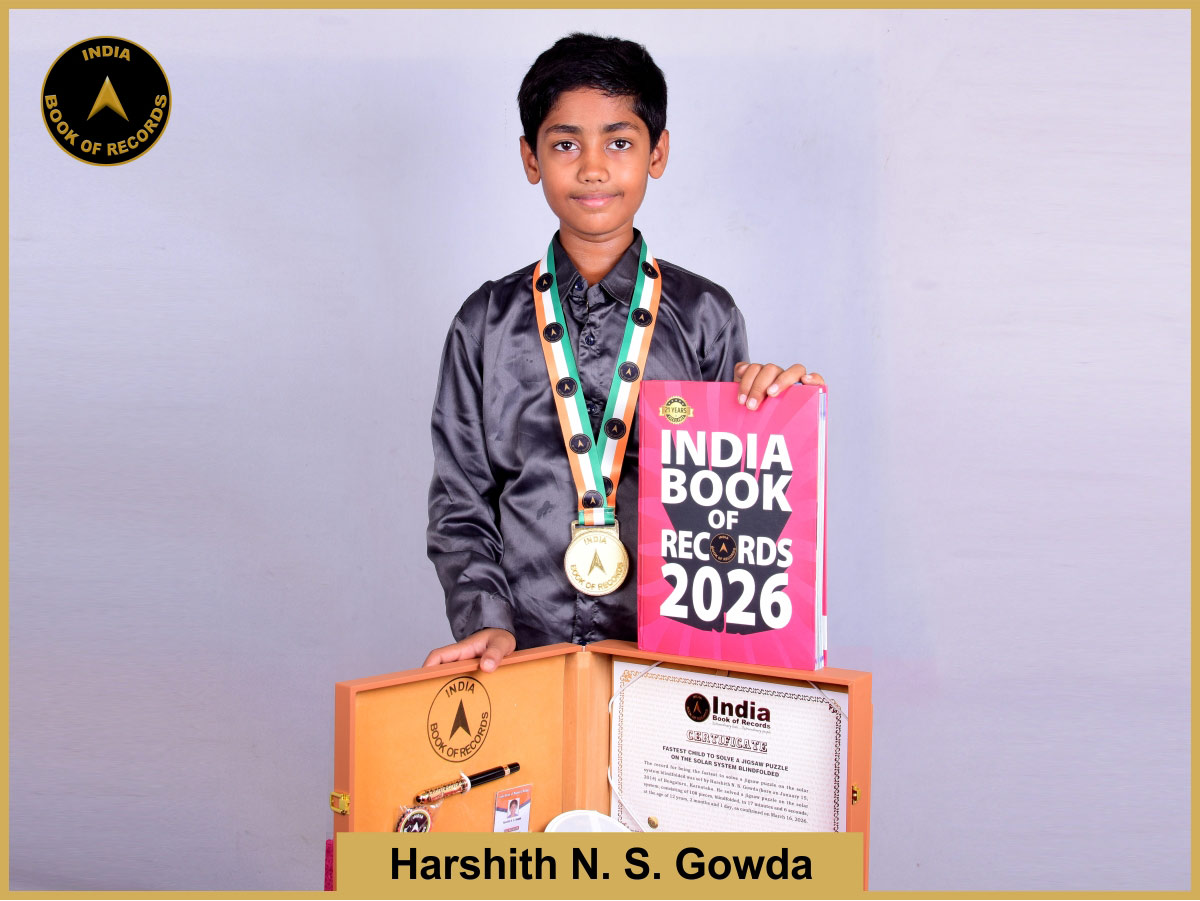 Fastest child to solve a jigsaw puzzle on the solar system blindfolded