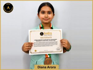 Pic of Diana Arora, Longest duration to sing and play an electronic keyboard by a child in full leg split pose.