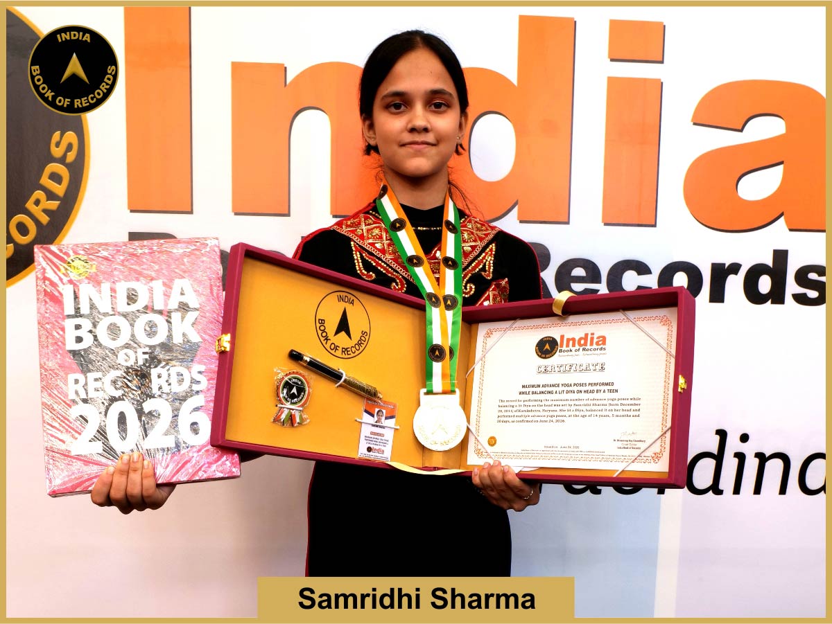 Maximum advanced-level yoga poses performed by a teen with a lit diya balanced on her head