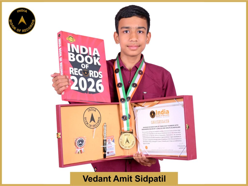 Pic of Vedant Amit Sidpatil, Maximum division sums of three-digit numbers with remainders solved by a child in one minute blindfolded