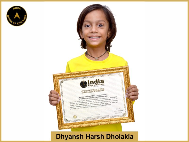Pic of Dhyansh Harsh Dholakia, Fastest kid to write all capital letters of the English alphabet in mirror writing.