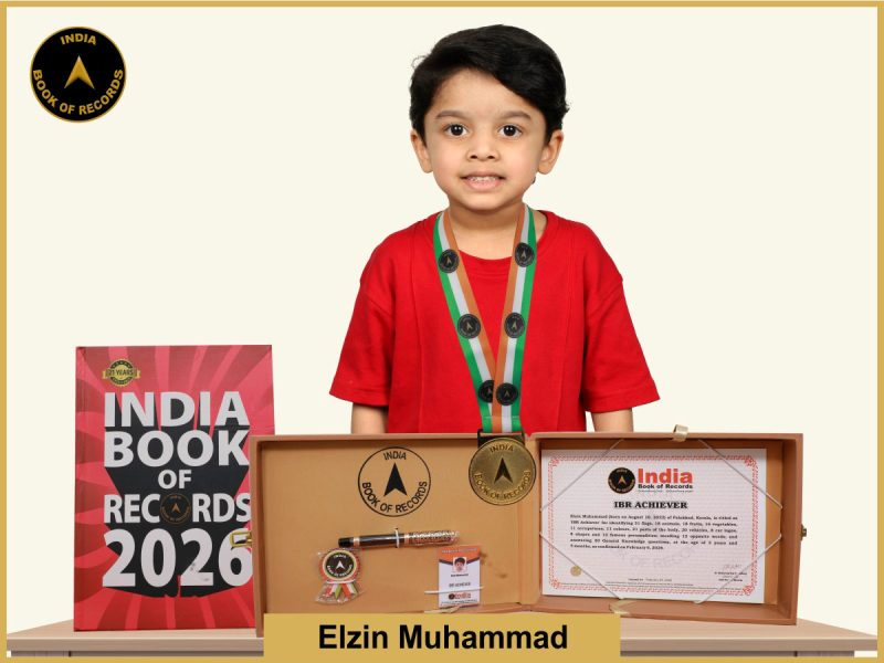 Image of Elzin Muhammad with IBR Achiever Certificate.
