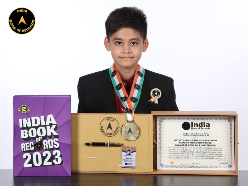 Fastest child to add 200 single digit numbers while performing hula hoop spins on a hoverboard