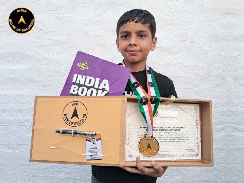 Fastest child to write English alphabet in reverse order blindfolded