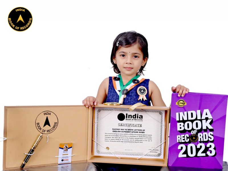 Fastest kid to write letters of English alphabet upside down