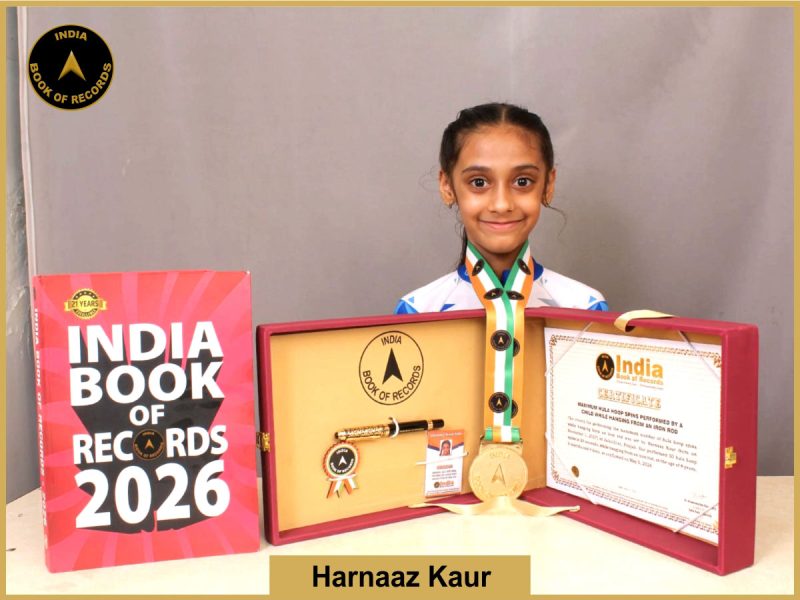 Image of Harnaaz Kaur, Maximum hula hoop spins performed by a child while hanging from an iron rod.