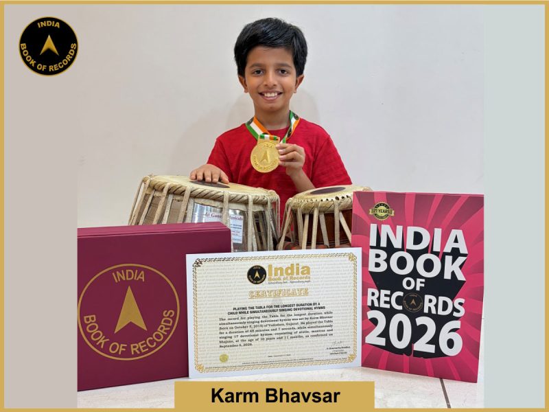 Image of Karm Bhavsar, Playing the Tabla for the longest duration by a child while simultaneously singing devotional hymns.