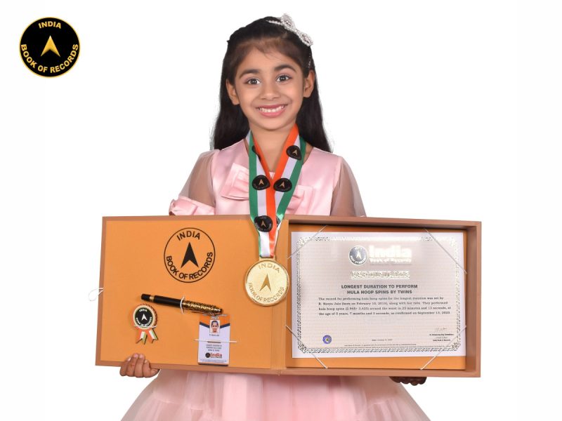 Longest duration to perform hula hoop spins by twins-R.Navya Jain