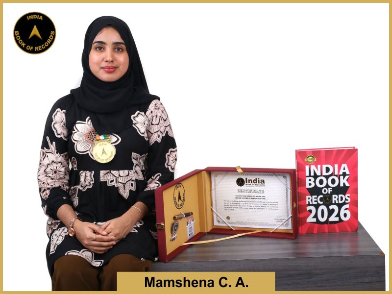 Pic of Mamshena CA, Fastest individual to write the Indian Pledge in mirror writing.