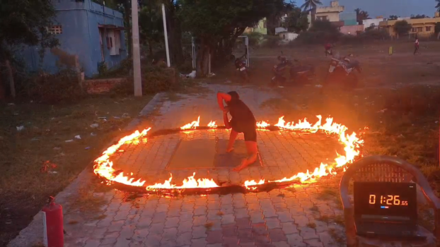 Maximum Yoga Asanas Performed Blindfolded Amid Fire