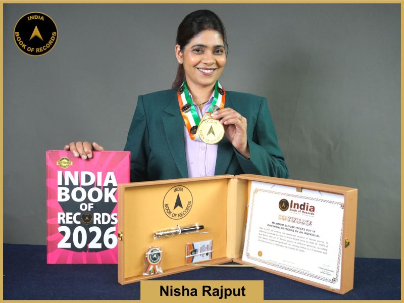 Image of Nisha Rajput with Maximum blouse pieces cut in different patterns by an individual Record IBR Certificate.