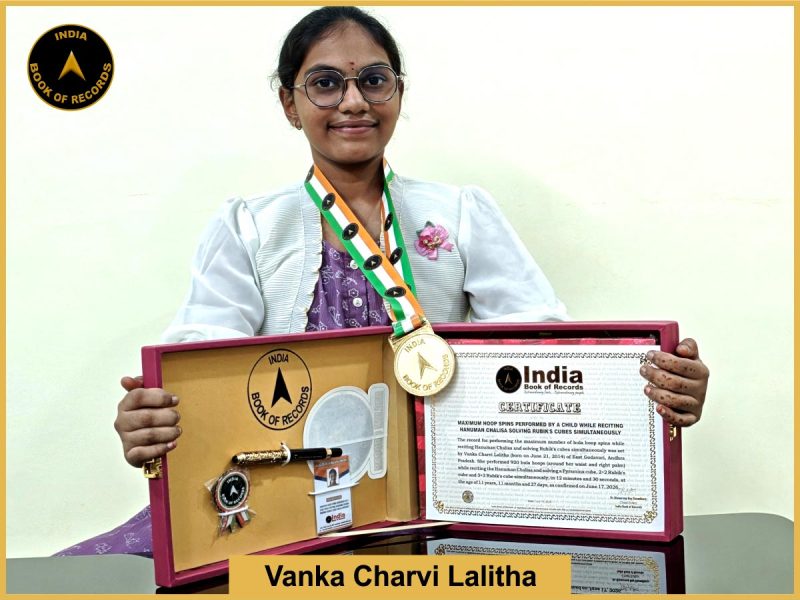 Pic of Vanka Charvi lalitha, Maximum hoop spins performed by a child while reciting Hanuman Chalisa solving Rubik’s cubes simultaneously.