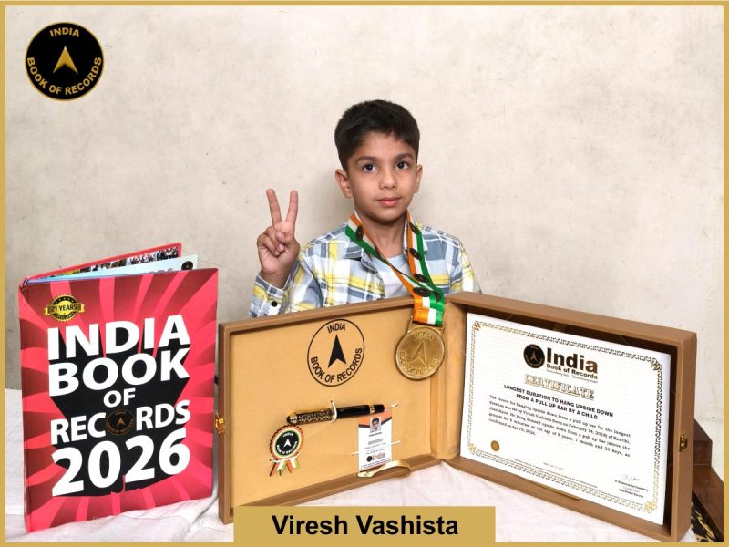 Image of Viresh Vashista, Longest duration to hang upside down from a pull up bar by a child.