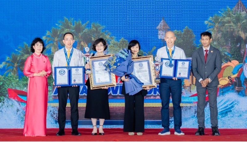 Nguyen Hoang Anh, Vice President of the Vietnam Book of Records & General Secretary of the World Records Union (extreme left) and Dr. Biswaroop Roy Chowdhury (extreme right) conferring the World Records Certificates to the officials of the Sun Group of Vietnam